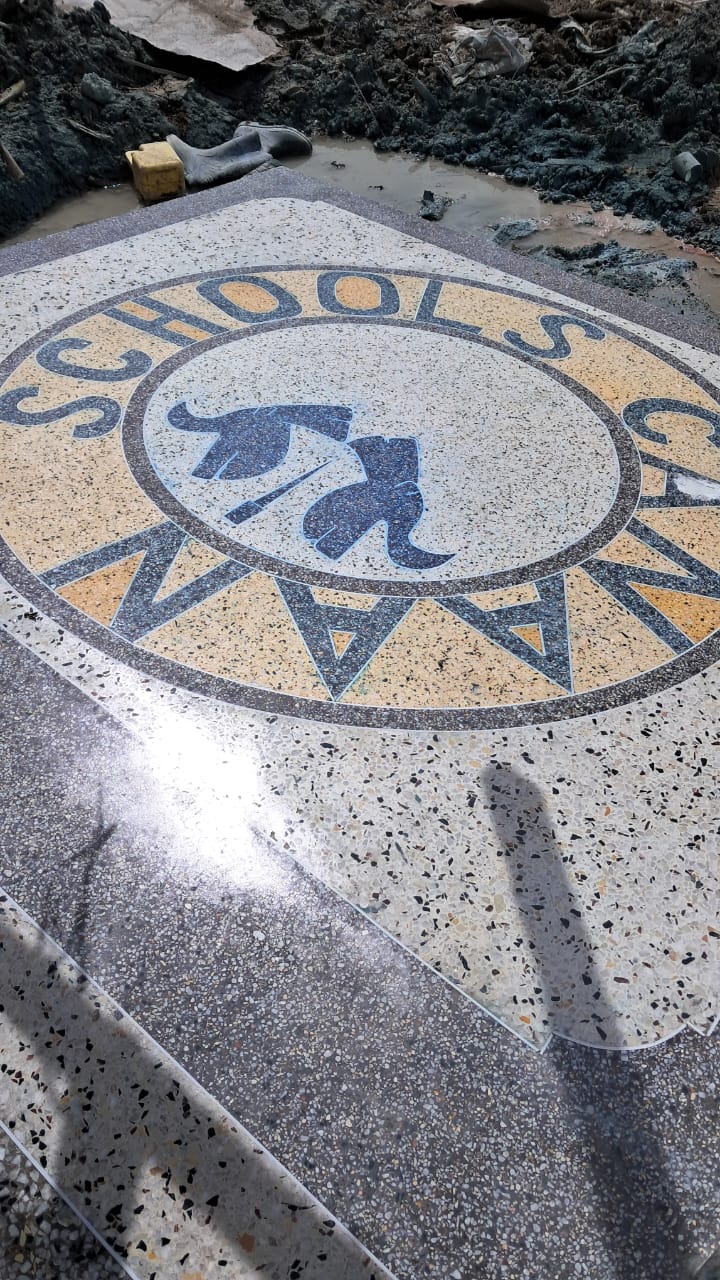 Custom school logo formed in terrazzo