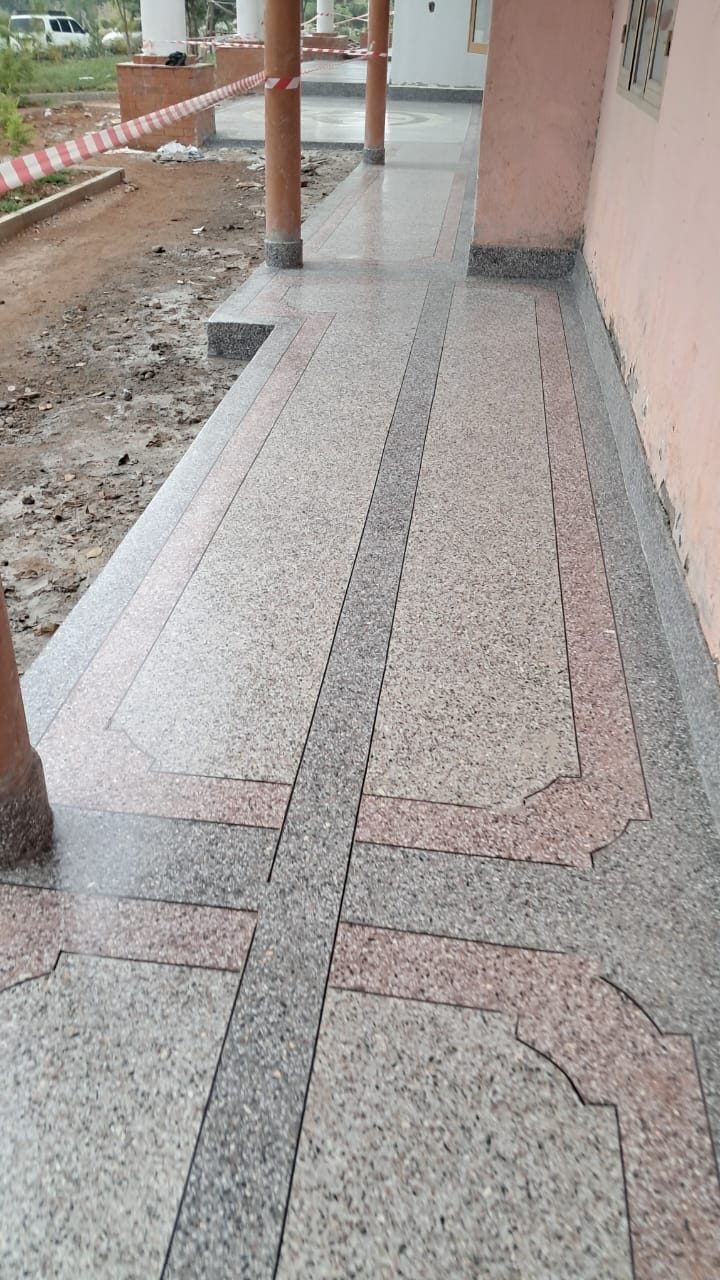 Long terrazzo walkway with decorative borders