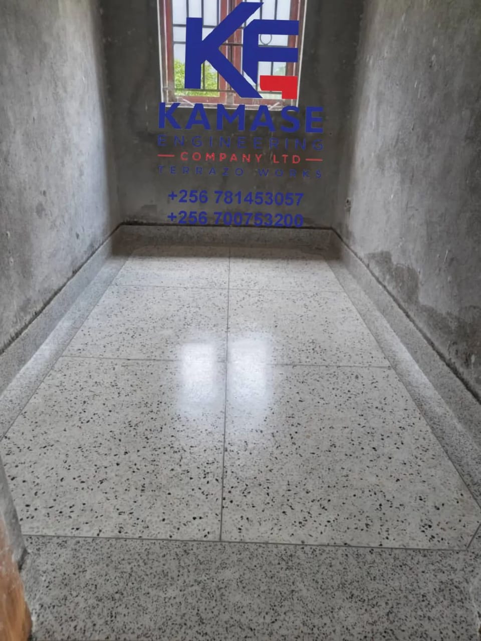 Terrazzo corridor with cream and charcoal border design